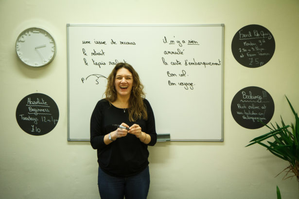 Carole teaching French in front of a whiteboard